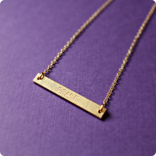Speakable Engraved PEACE Necklace